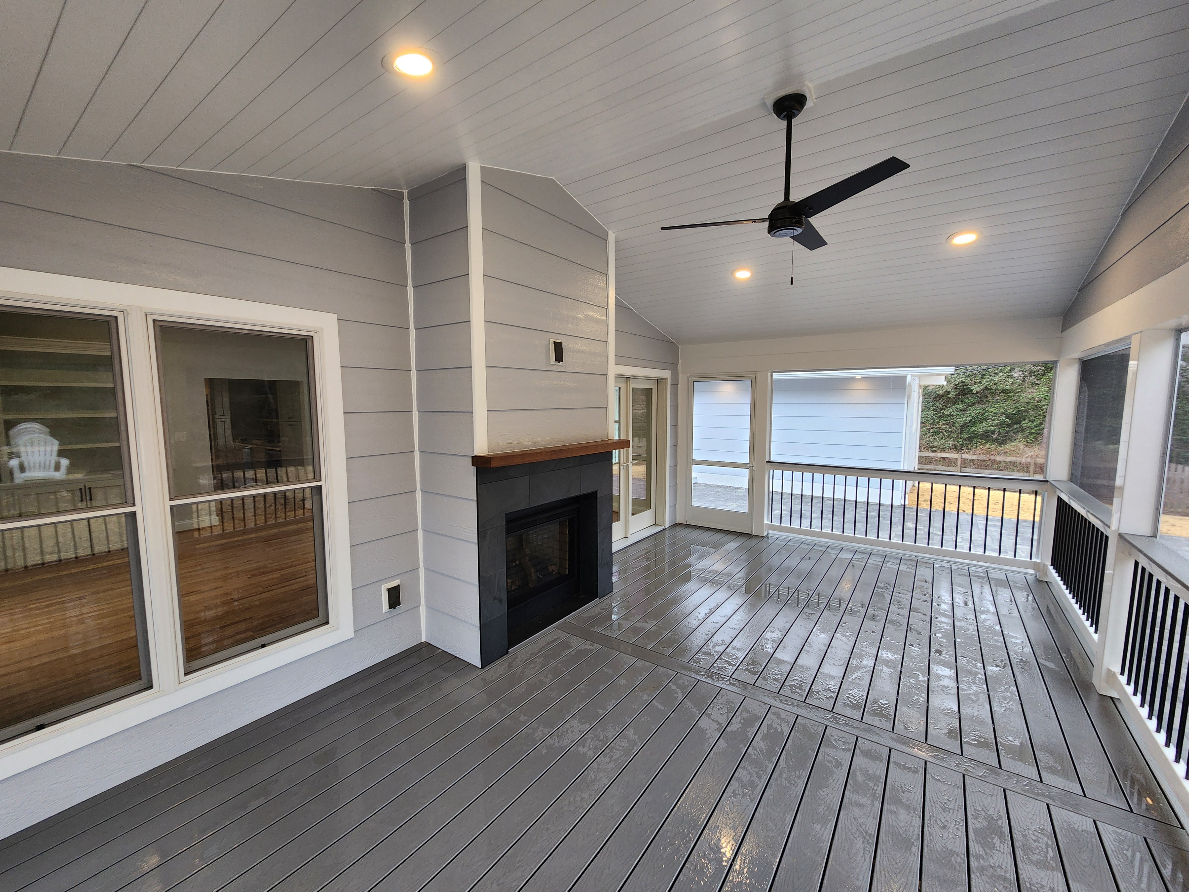 screened in porch with fireplace. 2024